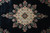 Detailed close-up of the ivory and gold Kerman medallion with red, blue and green floral rosettes