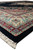Low angle along the border of this black and ivory hand-knotted Oriental rug made in India