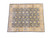 8'3" x 9'9" hand-knotted Oriental rug shown at an angle over white studio background