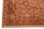 Corner detail with brown palmette border, coral guard stripes and hand-sewn selvage on beige ground