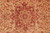 Central rust medallion close-up with rosettes, hearts and olive accents on a camel beige field