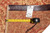 Back tag reading genuine hand woven oriental rug with tape measure confirming 3'8 x 5'3 size