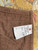 Back corner with brown cotton lining and original hand woven tag marked rug number 6725