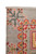 Corner close-up showing ivory fringe, pink blossom spray and coral serrated border on gray wool