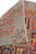 5'9" x 8'2" rug back folded over, revealing tight knot density and pale gray foundation