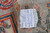 Back tag reading hand-knotted in Pakistan, 100% natural wool, size 250 x 175 cm