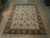 8'2" x 10'2" hand-knotted Chobi rug from India displayed flat on light hardwood showroom floor