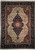 Full overhead view of 8'10" x 12' ivory Serapi rug with black medallion and rust spandrels