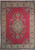Red and ivory semi antique Persian rug with central floral medallion and ivory palmette border