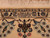 Woven signature cartouche in the upper border, marking a named Nain workshop weaver and fine knotting