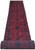 Extra long 25 foot Khal Momadi hallway runner in deep red, rolled end resting on white background