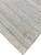 Diagonal corner detail showing dense low pile and subtle horizontal abrash lines in pale gray