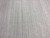 Wide detail of the borderless gray field showing even pile height and clean tonal shading