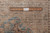 9x12 Persian rug back with ruler confirming authentic hand-knotted construction and tight knot count
