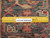 Ruler on the back of the 7x11 Heriz showing hand-knotted rows and wool weave