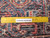 Rug back with ruler showing knot density and Authentic Handmade label on this Heriz