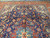 Close view of navy field with red and ivory palmettes on hand-knotted Persian wool rug