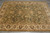 6x9 Chobi rug viewed from above with palmettes, curling vines and navy serrated leaves