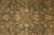Close-up of vine scroll pattern with gold rosettes, navy serrated leaves and salmon pink accents