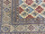 Border and field junction of wool and silk Nain rug, tribal style medallions in ivory
