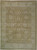 Full overhead view of tussock brown Chobi Peshawar rug with ivory border and cream palmettes
