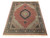 5'2" x 8' wool and silk rug displayed at an angle with ivory fringe ends