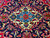 Ivory and turquoise center medallion with 8 petal rosette on navy Kashan ground