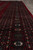 Detail of rosette medallions inside the main border band, showing fine knotting and clear geometric drawing