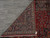 Back of the 9'6" x 12'10" Mashad rug showing tight hand-knotting and cotton foundation