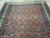 5x6 antique Persian rug end showing ivory fringe, navy guard borders and blue boteh rows