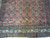 Close-up of ivory turtle border, navy guard stripes and teal boteh forms on coral ground