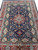 Overhead view of the 6x9 Sino Tabriz rug laid flat on white studio floor