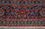 Straight-on border study showing navy ground, pink vinework, palmettes and ivory guard stripes