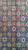 Close-up of hand-knotted rosettes in ivory, gold and rust across a bright azure blue field