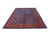 Angled floor shot of large 10x13 Persian wool rug showing sapphire field and madder red border