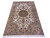 Angled studio shot showing ivory field, sage spandrels and camel border of this wool and silk rug