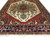 9' x 11'11" hand-knotted wool rug showing camel gold medallion and turquoise pendant rosettes