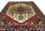 Serapi design rug with stepped medallion, serrated leaves and small animal figures on cream field
