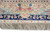 Detail of ivory main border with rose vine, blue blossoms and navy floral guard stripe
