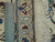 Ruler against the border of the 5'1 x 8'1 Nain rug showing fine knots per square inch