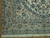 Corner detail showing palmette main border, heart motif guard stripes and ivory fringe on parquet