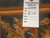 Reverse side with inventory tag reading genuine hand woven Oriental rug number 6344, size 8 x 10