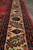 Cream main border detail with red tulip buds, navy palmettes and multiple guard stripes
