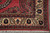 Corner detail with cream border, navy rosettes, red guard stripes and hand-tied ivory fringe