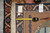 Reverse of the rug with dealer tag reading LA 53201 and a tape measure across the weave