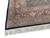 Corner detail showing red main border palmettes, paisley motifs and ivory cotton fringe tassels