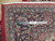 Ruler on border confirms authentic handmade hand-knotted wool pile, ivory fringe and fine floral drawing