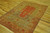 4' x 6'2" Kayseri rug seen at an angle, wool pile sheen and muted coral tones