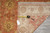 Tape measure and inventory tag confirming the 5'4" x 6'9" size on the rug back