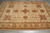 6'7" x 10' hand-knotted Oriental rug lengthwise, ivory field framed by floral main border